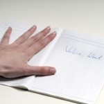 left hand and book